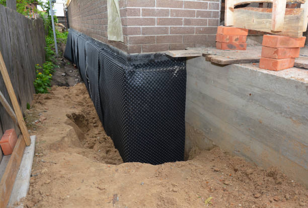 Happy homeowners after waterproofing job in Wixom